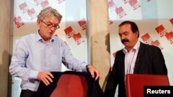 French Force Ouvriere (FO) labor union General Secretary Jean-Claude Mailly (L) and French CGT trade union head Philippe Martinez attend a news conference in Montreuil, outside Paris, France, June 22, 2016.