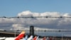 FILE - Airplanes are seen parked on the tarmac at Adolfo Suarez Barajas Airport in Madrid, Spain, Dec. 15, 2020.