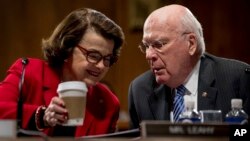 Sen. Dianne Feinstein, D-Calif., talks to Sen. Patrick Leahy, D-Vt., on Capitol Hill in Washington during the Senate Judiciary Committee's business meeting to discuss the nomination of Attorney General-designate Sen. Jeff Sessions, R-Ala., Jan. 31, 2017. Senate Democrats retaliated for Sally Yates' removal at the Department of Justice by derailing Sessions' expected confirmation, citing concerns that his closeness to President Donald Trump would impede his ability to make independent decisions in the role.