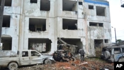 This Jan. 27, 2018 photo released by the provincial government of Esmeraldas shows a police station after a bomb went off overnight in San Lorenzo, Ecuador, near the border with Colombia. 