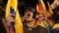 Supporters of presidential candidate Guillermo Lasso protest near the National Electoral Council in Quito, Ecuador, Sunday, April 2, 2017.