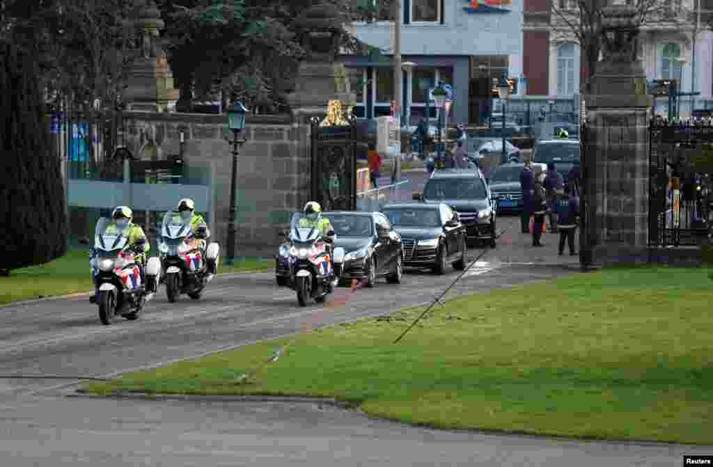 A motorcade with Myanmar&#39;s leader Aung San Suu Kyi arrives at the International Court of Justice (ICJ), ahead of hearings in a case filed by Gambia against Myanmar alleging genocide against the minority Muslim Rohingya population, in The Hague, Netherland