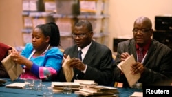 Zimbabwe Election Commission (ZEC) officials count special votes in Harare, July 19, 2013