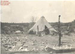 Residents of the Greenwood district of Tulsa, Oklahoma, living in tents after White mob violence destroyed the once-thriving African American area. (Ella Mahler Collection, OHS).