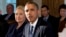 FILE - This Nov. 28, 2012 file photo shows then-Secretary of State Hillary Rodham Clinton listening as President Barack Obama speaks in the Cabinet Room at the White House in Washington. 