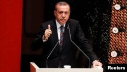 Turkey's Prime Minister Tayyip Erdogan addresses members of his ruling AK Party during a meeting at the party headquarters in Ankara, Turkey, Aug. 14, 2014. 