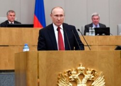 FILE - Russian President Vladimir Putin speaks during a session of the State Duma, the Lower House of the Russian Parliament, prior to its members voting on constitutional amendments, in Moscow, Russia, March 10, 2020.