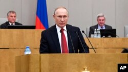 FILE - Russian President Vladimir Putin speaks during a session of the State Duma, the Lower House of the Russian Parliament, prior to its members voting on constitutional amendments, in Moscow, Russia, March 10, 2020.