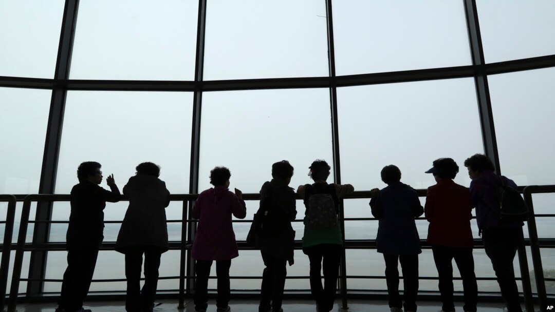 Visitors watch the North Korea side from the unification observatory in Paju, South Korea, April 25, 2017. 