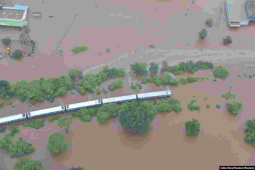 An aerial view shows a stranded passenger train in a flooded area near Badlapur, in the western state of Maharashtra, India, July 27, 2019.