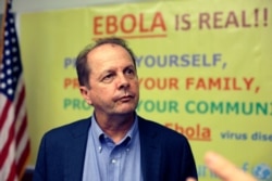 Dr Tom Kenyon, director of the Center for Disease Control's Center for Global Health, listens to a question at a news conference in Monrovia, Liberia, Oct. 1, 2014.