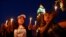 FILE - People attend a candlelight vigil for people missing after a boat carrying migrants from Tunisia sank off the southern Italian island of Lampedusa, September 2012, in Tunis September 10, 2012.