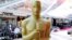 Oscar statue appears during the setup for the Academy Awards in Los Angeles. 