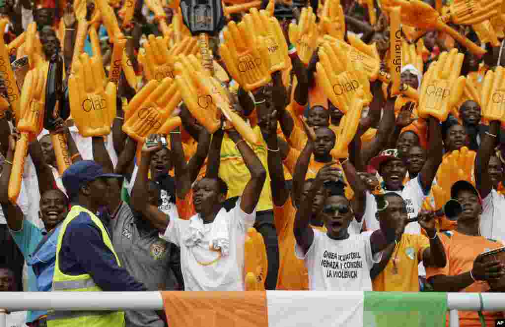 Ivory Coast soccer fans sing before their African Cup of Nations final soccer match with Ghana in Bata, Equatorial Guinea.