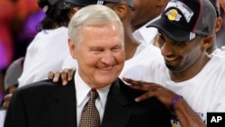 FILE - Los Angeles Lakers' Kobe Bryant gives basketball great Jerry West a shoulder rub after the Lakers beat the San Antonio Spurs in Game 5 of the NBA Western Conference basketball finals in Los Angeles, May 29, 2008. West died on June 12, 2024.