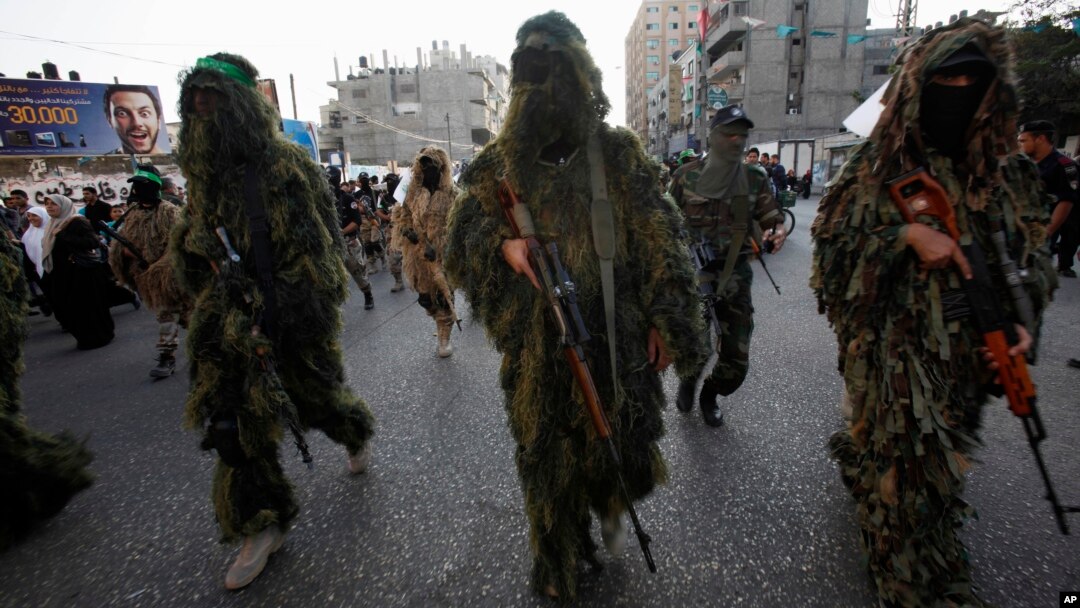 Masked Palestinian members of the Ezz Al-Din Al Qassam brigade, the military wing of Hamas in Gaza City, Nov. 14, 2013.