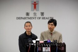Professor Yuen Kwok-yung, right, speaks next to Wong Ka-hing, the Controller of the Centre for Health Protection of the Department of Health during a press conference at the Health Department in Hong Kong, Jan. 11, 2020.