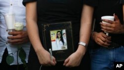 Friends and colleagues gather during a vigil in honor of Brazilian medical student Rayneia Lima, who was shot and killed in Managua, Nicaragua, July 26, 2018. 