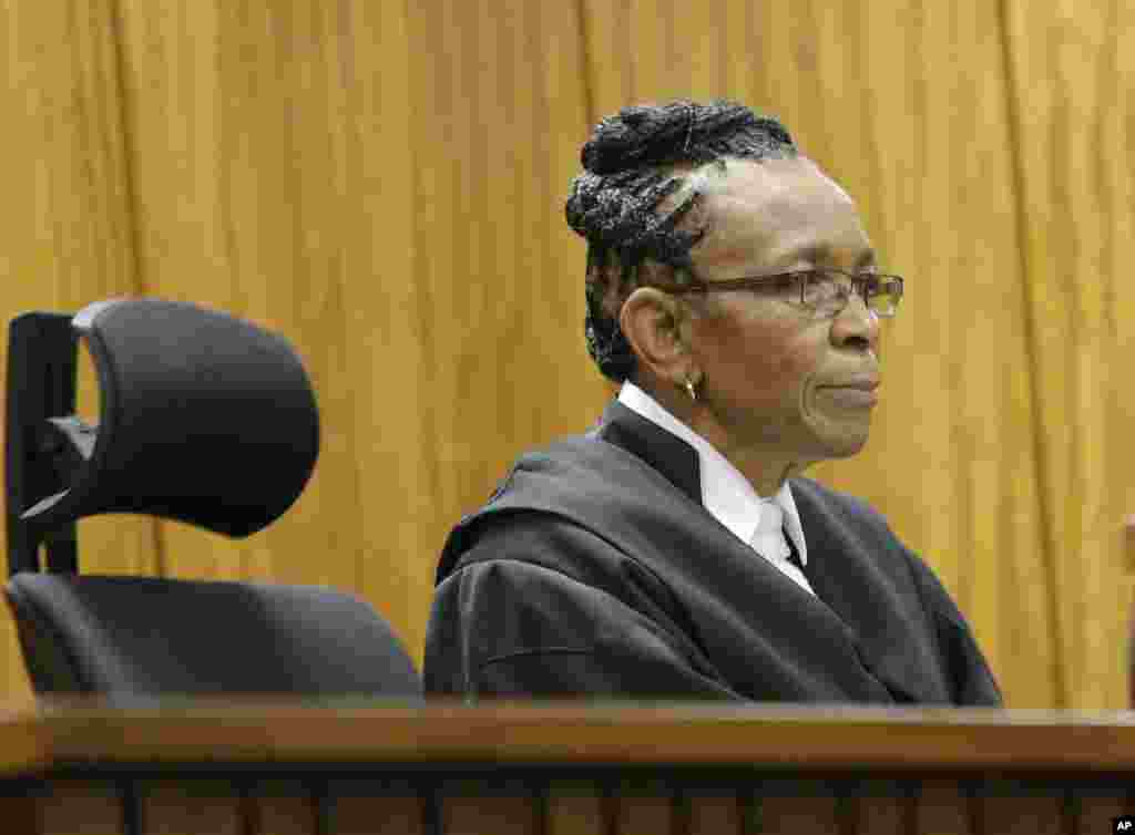 Judge Thokozile Masipa listens in court while State Prosecutor Gerrie Nel outlined his objections to the verdict and sentence against Pistorius who was convicted of the lesser charge of culpable homicide in October by Masipa, in Pretoria, South Africa, Dec. 9, 2014.