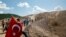 Environmental activists take part in a march to protest against what they say will be pollution from a foreign-owned gold mine project near the western town of Kirazli in Canakkale province, Turkey, Aug. 5, 2019. 