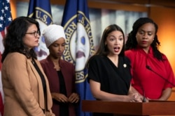 U.S. Rep. Alexandria Ocasio-Cortez, D-N.Y., speaks as, from left, Rep. Rashida Tlaib, D-Mich., Rep. Ilhan Omar, D-Minn., and Rep. Ayanna Pressley, D-Mass., listen during a news conference at the Capitol in Washington, July 15, 2019.