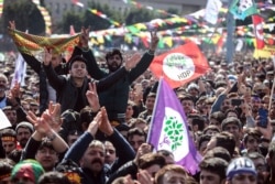 Thousands of supporters of pro-Kurdish Peoples' Democratic Party, gather to celebrate the Kurdish New Year and to attend a campaign rally for local elections that will test the Turkish president's popularity, in Istanbul, March 24, 2019.