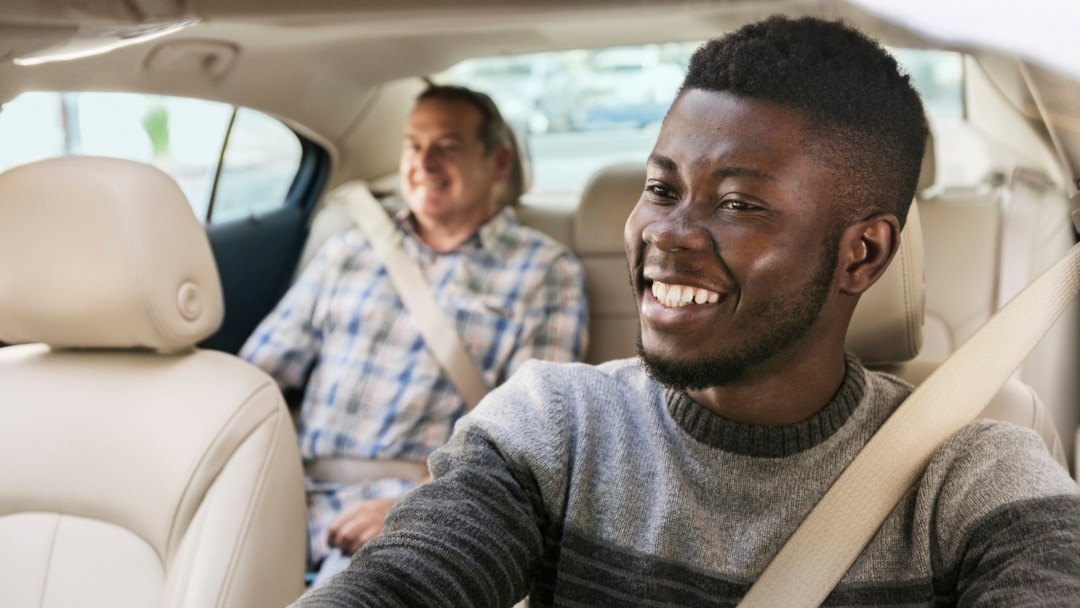 Driver and rider on a Ghanaian street