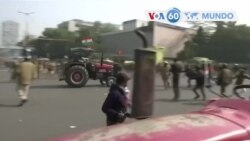 Manchetes mundo 26 Janeiro: Agricultores na Índia saltam barricadas e confrontam-se com a polícia