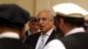 FILE - U.S. Special Representative for Afghanistan Reconciliation Zalmay Khalilzad attends the Intra Afghan Dialogue talks in the Qatari capital, Doha, July 8, 2019.