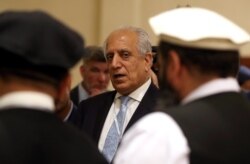 FILE - U.S. Special Representative for Afghanistan Reconciliation Zalmay Khalilzad attends the Intra Afghan Dialogue talks in the Qatari capital, Doha, July 8, 2019.