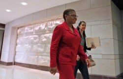 FILE - Rep. Karen Bass, D-Calif., walks through the Capitol Visitor's Center on Capitol Hill in Washington.