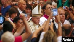 Pope Francis arrives to lead a mass marking World Day of Prayer for the Care of Creation in Saint Peter's Basilica at the Vatican, Sept. 1, 2015.