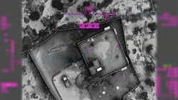 This image from video released by the U.S. Department of Defense, Oct. 30, 2019, and displayed at a Pentagon briefing, shows an image of the compound of then-Islamic State leader Abu Bakr al-Baghdadi moments before it was destroyed on Oct. 26, 2019.