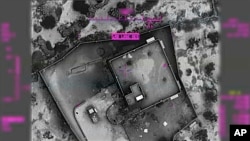 This image from video released by the U.S. Department of Defense Oct. 30, 2019, and displayed at a Pentagon briefing, shows an image of the compound of then-Islamic State leader Abu Bakr al-Baghdadi moments before it was destroyed Oct. 26, 2019.