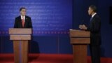 Republican presidential candidate Mitt Romney, left, listens to President Barack Obama during the first presidential debate at the University of Denver, Oct. 3, 2012.