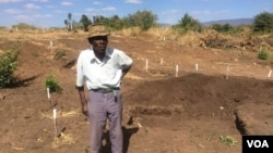 A villager showing part of his field that has been demined by Halo Trust in Mukumbura communal lands.