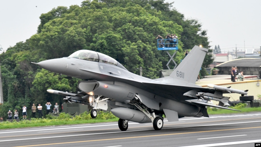 FILE - An U.S.-made F-16V fighter jet lands on the freeway in Changhua county, central Taiwan, May 28, 2019. 