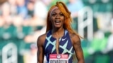 Sur cette photo du 19 juin 2021, Sha'Carri Richardson célèbre sa victoire après avoir remporté la première manche de la demi-finale du 100 mètres féminin lors des essais olympiques d'athlétisme des États-Unis à Eugene, Oregon, États-Unis.