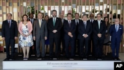 FILE - Participants of the 16th meeting of the Lima Group pose for a group photo at the Itamaraty Palace, in Brasilia, Brazil, Nov. 8, 2019.