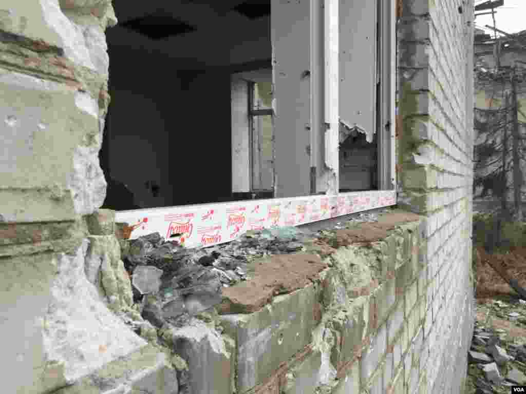 The glass appears freshly shattered, but is from the shelling of two years ago, Donetsk region, Ukraine, March 6, 2016. (L. Ramirez/VOA)