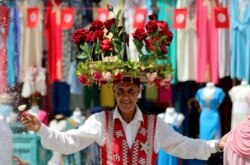 A flower seller is pictured at the old market in Tunis, Tunisia, July 30, 2021.