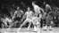 FILE - Boston's Sam Jones, left, gets past the Lakers' Jerry West (44) and drives along the baseline toward the basket in the teams' NBA playoff game in Los Angeles on May 2, 1968. Basketball Hall of Famer Jones died Dec. 30, 2021, at 88.