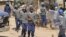 FILE: Armed Zimbabwean police battle rioters in Harare, Monday, July, 4, 2016.