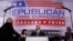 Vice Presidential nominee Gov. Mike Pence, center, and his wife Karen, stand on stage before the third day session of the GOP 2016 Convention, July 20, 2016, in Cleveland. 