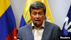 FILE - Pablo Beltran, representative of the delegation of National Liberation Army (ELN), attends a news conference during peace talks between the government of Colombia and the ELN guerrilla in Quito, Ecuador, June 30, 2017. 