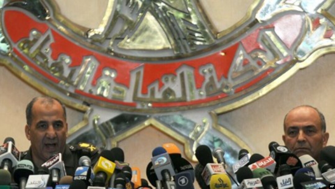 General Mahmud Hegazi (R) and General Adel Emara during a press conference to explain what caused the clashes between Egyptian military forces and Egyptian Christian copts in Cairo, October 12, 2011.
