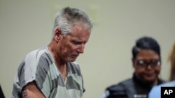 FILE - Colin Gray, 54, the father of Apalachee High School shooting suspect Colt Gray, 14, enters the Barrow County courthouse for his first appearance in Winder, Georgia, Sept. 6, 2024.