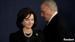 Brazil's President Michel Temer is seen near Brazil's new Attorney General Raquel Dodge during her inauguration, in Brasilia, Sept. 18, 2017.