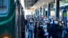 Commuters crowd Cadorna train station in Milan, Italy, May 4, 2020.