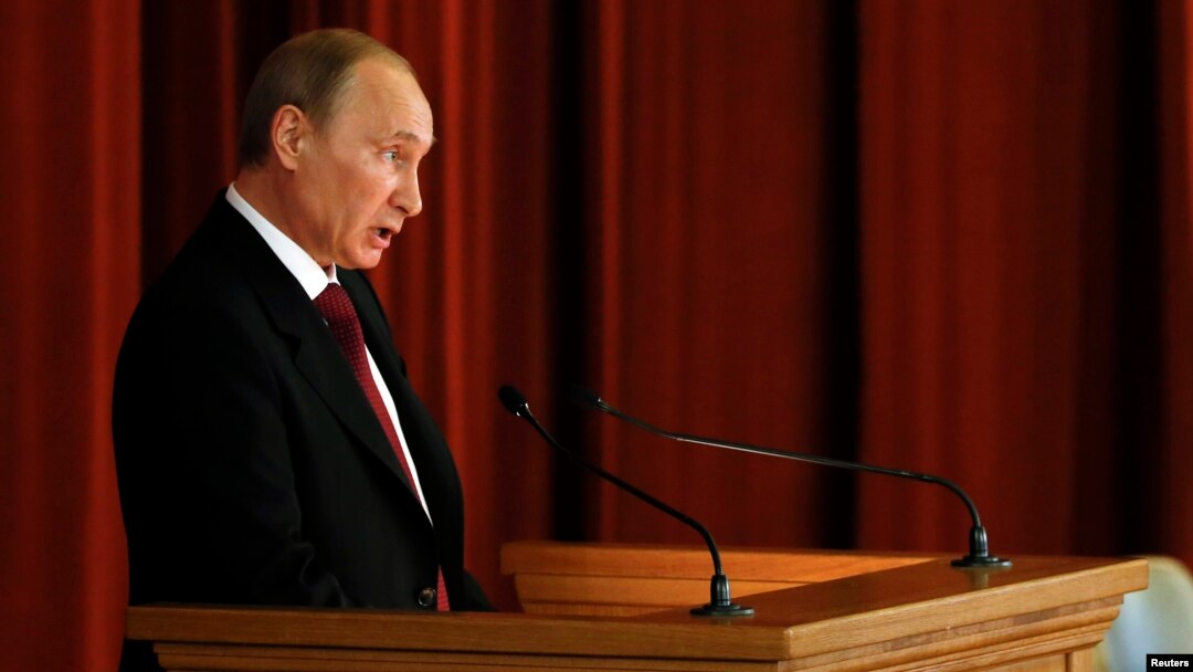 Russian President Vladimir Putin delivers a speech during a meeting with Russian ambassadors, envoys and diplomats at the Foreign Ministry headquarters in Moscow, July 1, 2014.